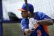 New York Mets' Curtis Granderson takes batting practice during spring training baseball Saturday, Feb. 22, 2014, in Port St. Lucie, Fla. (AP Photo/Jeff Roberson)