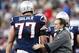New England Patriots head coach Bill Belichick gives New England Patriots tackle Nate Solder (77) a pat on the back during the fourth quarter of an NFL football game against the Buffalo Bills in Foxborough, Mass., Sunday Jan. 1, 2012. The Patriots beat the Bills 49-21. (AP Photo/Elise Amendola)