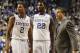 Kentucky head coach John Calipari, right, confers with Aaron Harrison (2) and Alex Poythress (22) during the second half of an NCAA college basketball game against Eastern Michigan, Wednesday, Nov. 27, 2013, in Lexington, Ky. Kentucky won 81-63. (AP Photo/James Crisp)