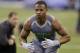 Oklahoma State defensive back Justin Gilbert runs a drill at the NFL football scouting combine in Indianapolis, Tuesday, Feb. 25, 2014. (AP Photo/Michael Conroy)