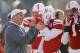 Nebraska head coach Bo Pelini visits with players during warmups as Iowa and Nebraska prepare to square off in an NCAA college football game in Lincoln, Neb., Friday, Nov. 29, 2013. (AP Photo/Nati Harnik)