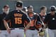 San Francisco Giants manager Bruce Bochy (15) looks on as a group of mostly catchers return during spring training baseball practice on Sunday, Feb. 16, 2014, in Scottsdale, Ariz. (AP Photo/Gregory Bull)