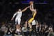 Los Angeles Lakers guard Jordan Farmar, right, puts up a shot as Sacramento Kings guard Ray McCallum defends during the second half of an NBA basketball game, Friday, Feb. 28, 2014, in Los Angeles. (AP Photo/Mark J. Terrill)