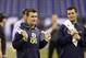 Texas A&M quarterback Johnny Manziel watches drills with Fresno State quarterback Derek Carr at the NFL football scouting combine in Indianapolis, Sunday, Feb. 23, 2014. (AP Photo/Michael Conroy)