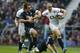 England's Mike Brown, right, tries to escape from Argentina's Nicolas Sanchez during their autumn international rugby match at Twickenham Stadium in London, Saturday, Nov. 9, 2013. (AP Photo/Sang Tan)