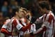 Sunderland's Adam Johnson, left, celebrates his goal with his teammates during their English Premier League soccer match against Stoke City at the Stadium of Light, Sunderland, England, Wednesday, Jan. 29, 2014. (AP Photo/Scott Heppell)