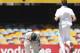 Australia's Michael Clarke reacts after being hit by a ball bowled by South Africa's Morne Morkel, right, during day five of the first cricket test between Australia and South Africa at the Gabba stadium in Brisbane, Australia, Tuesday, Nov. 13, 2012. (AP Photo/Tertius Pickard)