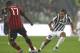 TURIN, ITALY - OCTOBER 06: Carlos Tevez (R) of Juventus FC competes for the ball with Cristian Zapata of AC Milan during the Serie A match between Juventus FC and AC Milan at Juventus Arena on October 6, 2013 in Turin, Italy. (Photo by Marco Luzzani/Getty Images)