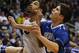 Xavier's Justin Martin and Creighton's Doug McDermott look for a rebound in the second half of an NCAA college basketball game in Cincinnati on Saturday, March 1, 2014. Xavier won 75-69. (AP Photo/Tom Uhlman)