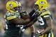 Green Bay Packers' Casey Hayward is congratulated by teammate Datone Jones (95) after intercepting a pass during the first half of an NFL preseason football game against the Seattle Seahawks Friday, Aug. 23, 2013, in Green Bay, Wis. (AP Photo/Morry Gash)