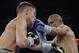 Orlando Salido, right, and, Vasyl Lomachenko, left, trade punches in a 12-round featherweight title bout on Saturday, March 1, 2014, in San Antonio. Salido won by split decision. (AP Photo/Eric Gay)