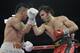 Julio Cesar Chavez Jr., right, delivers a punch to Bryan Vera during a 12-round super middleweight bout, Saturday, March 1, 2014, in San Antonio. Chavez won by decision. (AP Photo/Eric Gay)