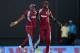 ANTIGUA, ANTIGUA AND BARBUDA - FEBRUARY 28: Dwayne Bravo and Darren Sammy of the West Indies celebrate winning the 1st One Day International between West Indies and England at Sir Viv Richards Cricket Ground on February 28, 2014 in Antigua, Antigua and Barbuda. (Photo by Gareth Copley/Getty Images)