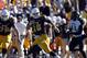 Nov 23, 2013; Laramie, WY, USA; Wyoming Cowboys quarterback Brett Smith (16) runs against the Hawaii Warriors during the second quarter at War Memorial Stadium. The Cowboys defeated the Warriors 59-56 in overtime. Mandatory Credit: Troy Babbitt-USA TODAY Sports