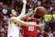 Indiana forward Will Sheehey, left, fouls Ohio State forward LaQuinton Ross as Ross goes to the basket in the first half of an NCAA basketball game in Bloomington, Ind. Sunday, March 2, 2014. (AP Photo/R Brent Smith)