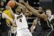 Iowa guard Roy Devyn Marble (4) is double-teamed by Purdue guard Rapheal Davis, right, and guard Ronnie Johnson, behind Marble, during the first half of a Big Ten NCAA college basketball game at Carver-Hawkeye Arena on Sunday, March 2, 2014, in Iowa City, Iowa. (AP Photo/Jim Slosiarek)