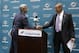 Dennis Hickey, new general manager for the Miami Dolphins football team, left, shakes hands with team owner Stephen Ross, right, during a news conference, Tuesday, Jan. 28, 2014, in Davie, Fla. (AP Photo/Lynne Sladky)