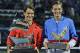 Roger Federer of Switzerland, left, and Tomas Berdych of Czech Republic display their trophies after Federer won the final match of the Dubai Duty Free Tennis Championships in Dubai, United Arab Emirates, Saturday, March 1, 2014. (AP Photo/Kamran Jebreili)