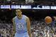 North Carolina's James Michael McAdoo celebrates following a dunk against UNC Wilmington during the second half of an NCAA college basketball game in Chapel Hill, N.C., Tuesday, Dec. 31, 2013. North Carolina won 84-51. (AP Photo/Gerry Broome)