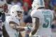 Daniel Thomas (left) and Mike Pouncey (right) were the Miami Dolphins' first two picks of the 2011 NFL draft.