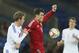 Wales' Gareth Bale, right, holds off the challenge of Finland's Veli Lampi during their international friendly soccer match in Cardiff, Wales, Saturday, Nov. 16, 2013. (AP Photo/Alastair Grant)