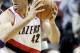 Portland Trail Blazers center Robin Lopez, right, works the ball in on Los Angeles Lakers center Pau Gasol, of Spain, during the first half of an NBA basketball game in Portland, Ore., Monday, March 3, 2014.(AP Photo/Don Ryan)