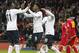 England's Daniel Sturridge, centre celebrates with teammates after scoring a goal from the penalty spot uring the World Cup Group H qualification soccer match between England and Montenegro at Wembley stadium in London, Friday, Oct. 11, 2013 . (AP Photo/Sang Tan)