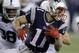 New England Patriots wide receiver Julian Edelman (11) runs from Indianapolis Colts defensive back Sergio Brown (38) after a catch during the second half of an AFC divisional NFL playoff football game in Foxborough, Mass., Saturday, Jan. 11, 2014. (AP Photo/Stephan Savoia)