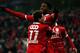 LIEGE, BELGIUM - JANUARY 25: Michy Batshuayi of Standard is congratulated by team mate Maor Buzaglo after he scores a goal during the Jupiler League match between Standard de Liege and KV Kortrijk at Stade Maurice Dufrasne the on January 25, 2013 in Liege, Belgium. (Photo by Dean Mouhtaropoulos/Getty Images)