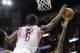 Detroit Pistons guard Brandon Jennings (7) has his shot blocked by Houston Rockets' Terrence Jones (6) during the first half of an NBA basketball game, Saturday, March 1, 2014, in Houston. (AP Photo/Bob Levey)