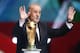 Spain head coach Vicente Del Bosque brings the World Cup trophy onto the stage during the draw ceremony for the 2014 soccer World Cup in Costa do Sauipe near Salvador, Brazil, Friday, Dec. 6, 2013. (AP Photo/Victor R. Caivano)