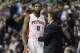 Detroit Pistons center Andre Drummond (0) talks with interim head coach John Loyer during the first half of an NBA basketball game against the Golden State Warriors in Auburn Hills, Mich., Monday, Feb. 24, 2014. (AP Photo/Carlos Osorio)