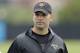 Jacksonville Jaguars general manager Dave Caldwell leaves the field after practice during NFL football organized training activities, Tuesday, May 21, 2013, in Jacksonville, Fla. (AP Photo/John Raoux)