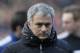 Chelsea's manager Jose Mourinho arrives at the dugout before the start of their English Premier League soccer match against Fulham, at Craven Cottage, London, Saturday, March 1, 2014. (AP Photo/Sang Tan)