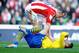 Olivier Giroud writhes in agony after a challenge from Charlie Adam that has seen him banned for three games.