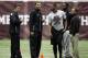 Texas A&M quarterback Johnny Manziel, from left, and receiver Mike Evans talk with linebacker Nate Askew as he prepares to compete in Texas A&M's pro day held Wednesday, March 5, 2014, in College Station, Texas. Manziel and Evans did not compete in the event. (AP Photo/Patric Schneider)