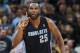 Charlotte Bobcats center Al Jefferson reacts after hitting key shot to put the Bobcats ahead of the Denver Nuggets late in the fourth quarter of the Bobcats' 101-98 victory in an NBA basketball game in Denver on Wednesday, Jan. 29, 2014. (AP Photo/David Zalubowski)