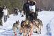 Cim Smyth of Big Lake, Alaska, drives his dog team along the Campbell Creek Airstrip during the ceremonial start of the 2014 Iditarod Trail Sled Dog Race on Saturday, March 1, 2014, in Anchorage, Alaska. (AP Photo/Dan Joling))