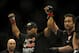 Feb 22, 2014; Las Vegas, NV, USA; Daniel Cormier (red gloves) celebrates his victory of Pactrick Cummins (not pictured) after their UFC light heavyweight bout at Mandalay Bay. Cormier won by way of a TKO in the first round. Mandatory Credit: Stephen R. Sylvanie-USA TODAY Sports