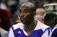 Dec 14, 2013; Charlotte, NC, USA; Los Angeles Lakers guard Kobe Bryant (24) watches his team from the bench during the first half of the game against the Los Angeles Lakers at Time Warner Cable Arena. Mandatory Credit: Sam Sharpe-USA TODAY Sports