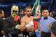 Alfredo Angulo, center, has his arm held up by the referee as a member of his team stands by after Angulo defeated Jorge Silva in their middleweight bout, Saturday, Dec. 15, 2012, in Los Angeles. (AP Photo/Mark J. Terrill)