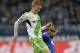 Wolfsburg's Kevin de Bruyne, left, and Schalke's Felipe Santana of Brazil challenge for the ball during the German Bundesliga soccer match between FC Schalke 04 and VfL Wolfsburg in Gelsenkirchen, Germany, Saturday, Feb. 1, 2014. (AP Photo/Martin Meissner)
