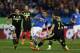 Italy’s Pablo Daniel Osvaldo, left, tries to score in between players during a international friendly soccer match between Spain and Italy at the Vicente Calderon stadium in Madrid, Spain, Wednesday, March 5, 2014. (AP Photo/Andres Kudacki)