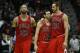 Chicago Bulls from left: Chicago Bulls power forward Taj Gibson (22), Chicago Bulls shooting guard Kirk Hinrich (12) ans Chicago Bulls center Joakim Noah (13) in the second half of an NBA basketball game Tuesday, Feb. 25, 2014, in Atlanta. Chicago won 107-103. (AP Photo/John Bazemore)