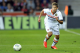 Monaco's Lucas Ocampos of Argentina, left, challenges for the ball with Lorient's Raphael Guerreiro of France during their French League One soccer match, in Monaco stadium, Sunday, Sept. 15, 2013. (AP Photo/Lionel Cironneau)
