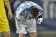 Argentina's Lionel Messi appears to vomit during an international friendly soccer game against Romania on the National Arena stadium in Bucharest, Romania, Wednesday, March 5, 2014. (AP Photo) ROMANIA OUT