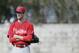 Philadelphia Phillies starting pitcher Cole Hamels looks on during spring training baseball practice Thursday, Feb. 13, 2014, in Clearwater, Fla. (AP Photo/Charlie Neibergall)