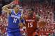 Cincinnati forward Jermaine Sanders (15) drives against Memphis guard Michael Dixon Jr. (11) in the first half of an NCAA college basketball game, Thursday, March 6, 2014, in Cincinnati. (AP Photo/Al Behrman)