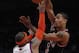 Chicago Bulls' Derrick Rose passes over New York Knicks' Carmelo Anthony (7) during the second half of an NBA basketball game Tuesday, April 12, 2011, in New York. The Bulls won 103-90. (AP Photo/Frank Franklin II)
