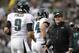 Philadelphia Eagles head coach Chip Kelly, right, congratulates quarterback Nick Foles (9) after Foles' touchdown pass to wide receiver Riley Cooper (14) during the second quarter of an NFL football game against the Oakland Raiders in Oakland, Calif., Sunday, Nov. 3, 2013. The Eagles won 49-20. (AP Photo/Ben Margot)